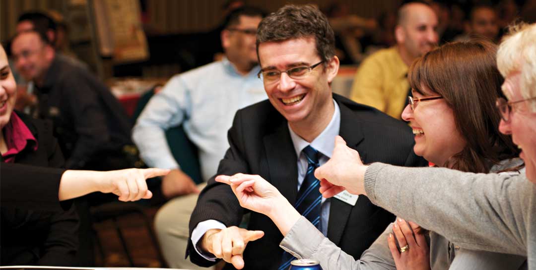 People engaging in a collaborative workshop focused on leadership and team performance.