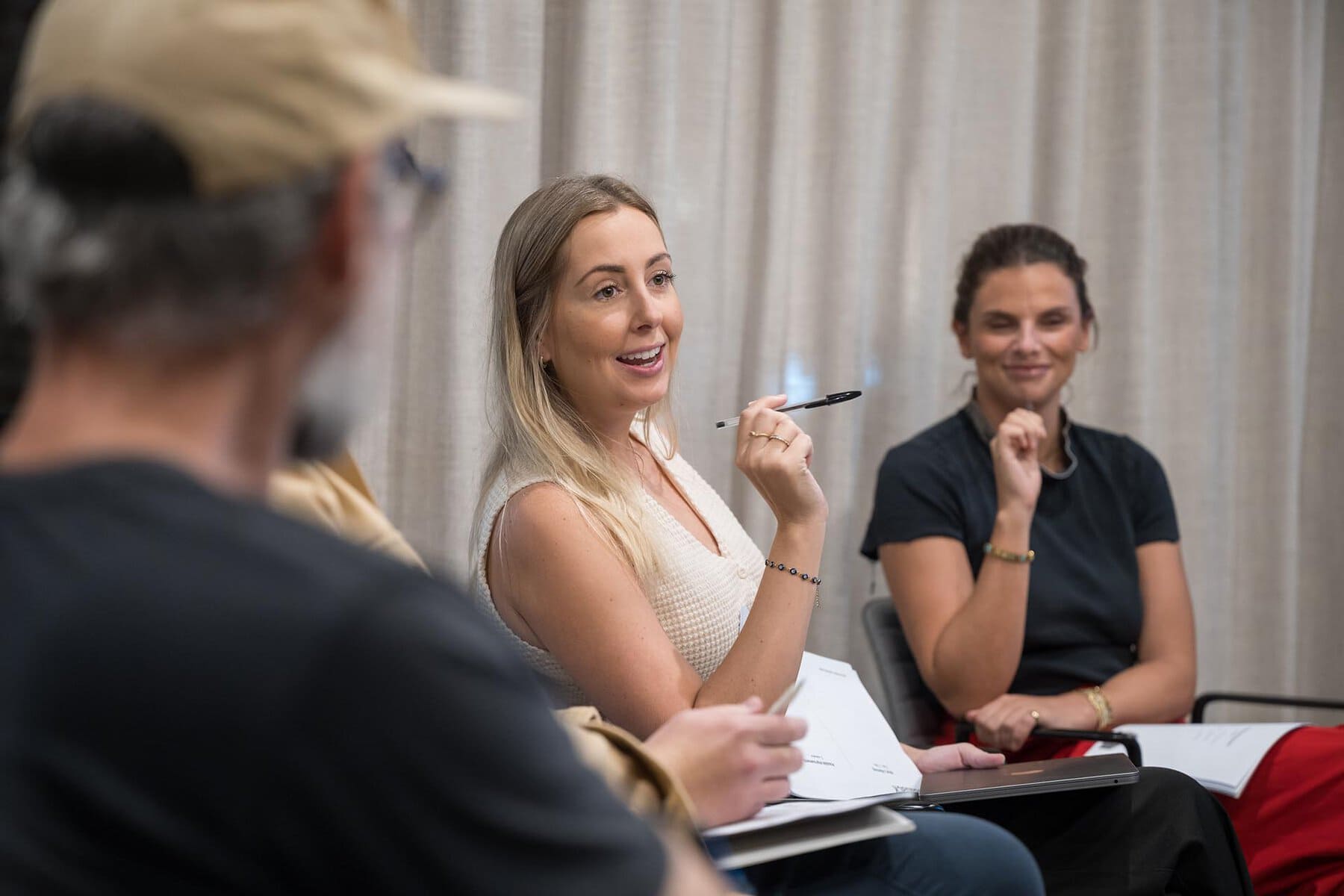 Engaged professionals participating in a leadership training session in Australia.